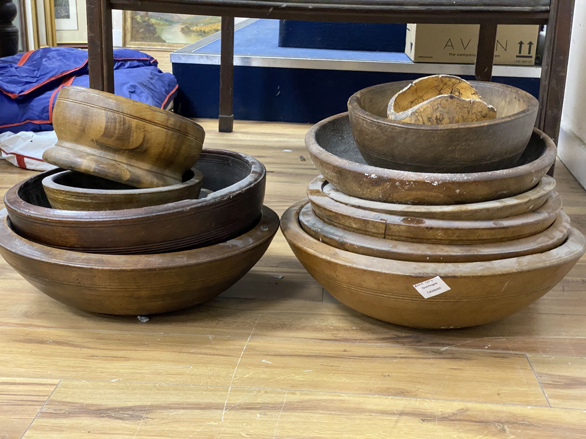 Thirteen large treen bowls, 19th/20th century